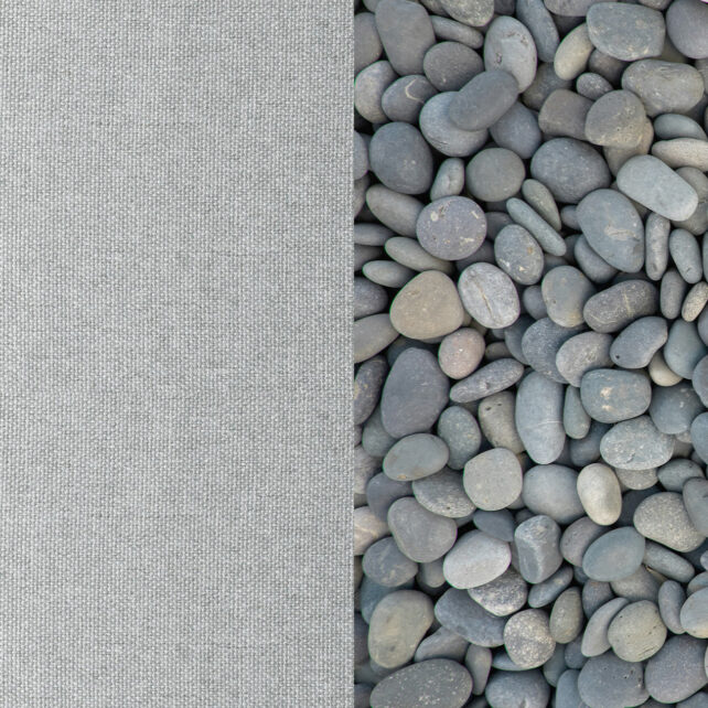 Ein vertikal geteiltes Bild mit glatten grauen Steinen auf der rechten Seite und einem strukturierten grauen Stoff auf der linken Seite, beide in ähnlichen Grautönen.