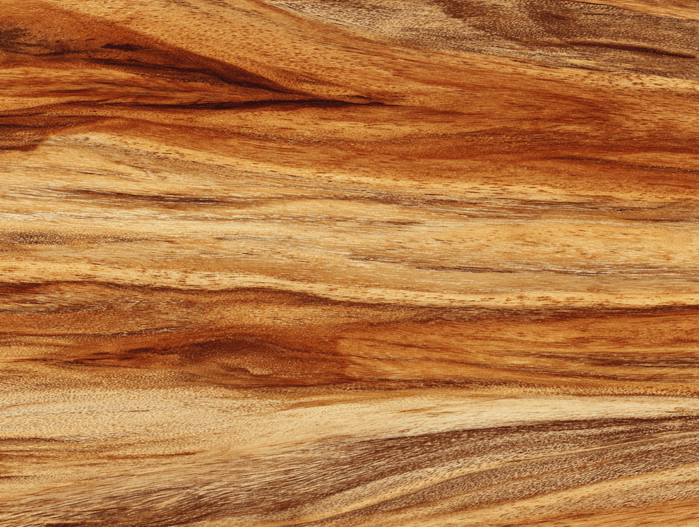 Nahaufnahme der Oberfläche von Akazienholz mit natürlichen, gewellten Maserungen in Braun-, Hellbraun- und Beigetönen, die eine glatte, organische Textur erzeugen.